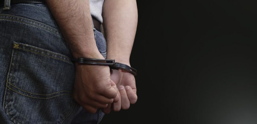Man With His Hands Handcuffed Behind His Back