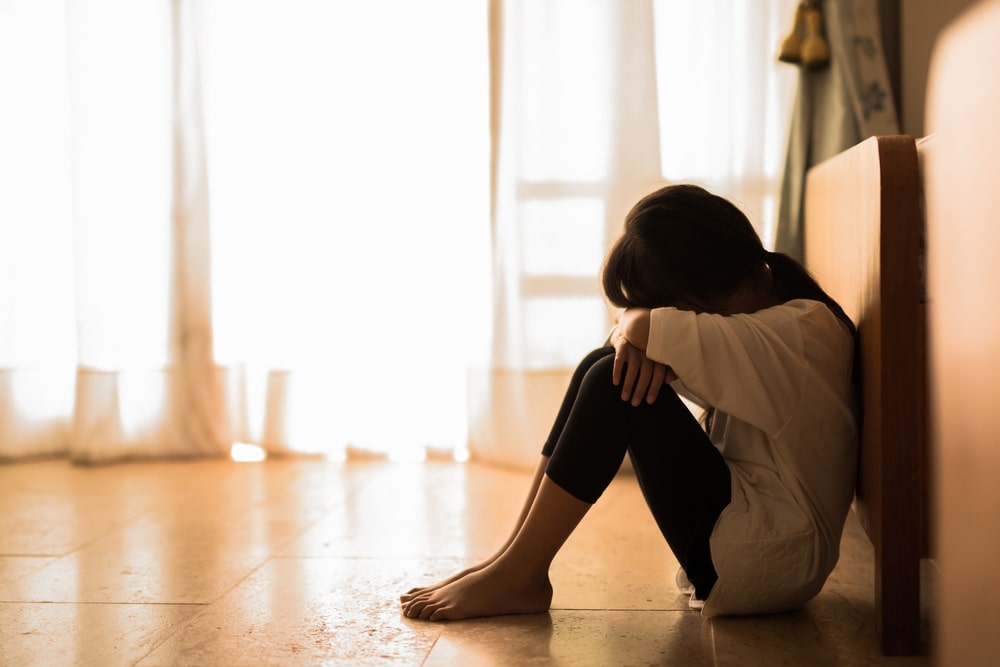 Domestic Abuse Woman Crying Sitting On The Floor