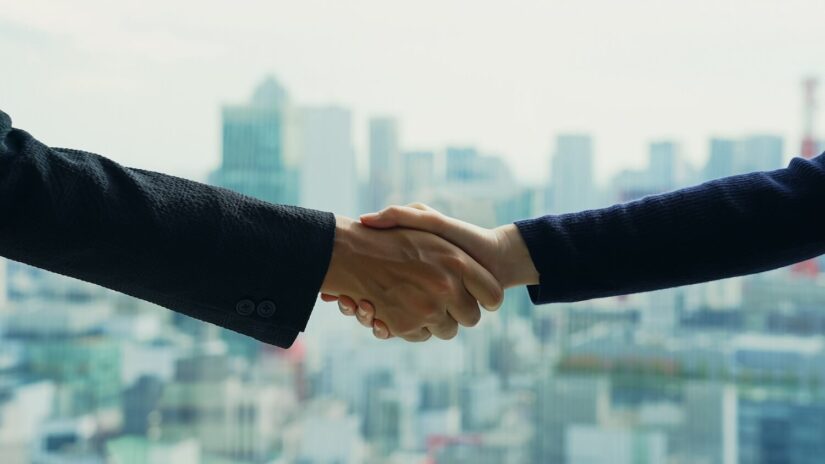 A couple of people shaking hands A couple of people shaking hands