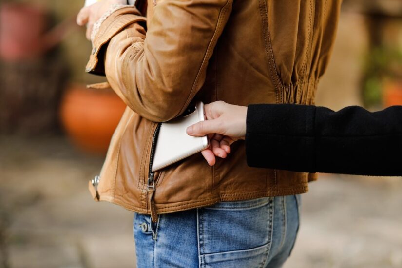 Pickpocket stealing an smartphone Pickpocket stealing an smartphone